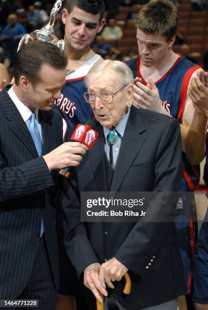 Legendary Basketball Coach John Wooden joined players from Saint Mary's College in Morgana, CA during trophy presentation celebration after winning...