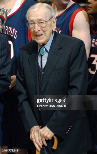 Legendary Basketball Coach John Wooden joined players from Saint Mary's College in Morgana, CA during trophy presentation after game, December 9,...