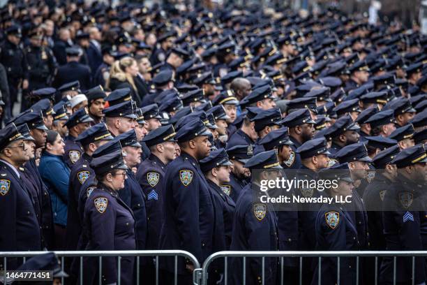 New York Police Department officers gather for the funeral of Adeed Fayaz outside the Makki Masjid Muslim Community Center in Midwood, Brooklyn, on...
