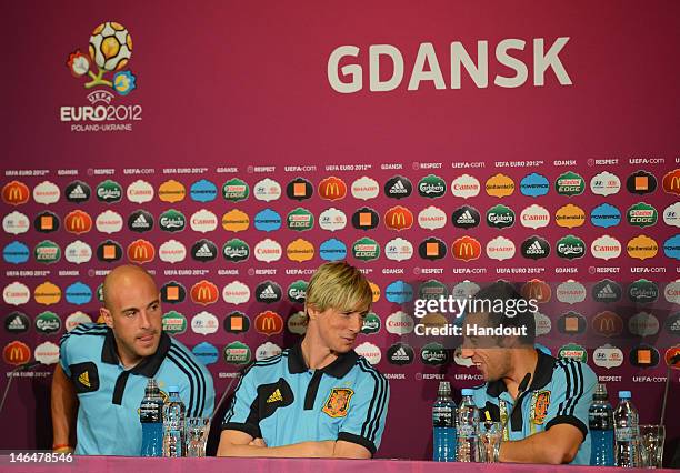 In this handout image provided by UEFA, Pepe Reina, Fernando Torres and Santi Cazorla of Spain talk to the media during a UEFA EURO 2012 press...
