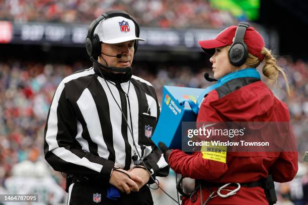 Referee Brad Allen looks at a replay during the game between the New England Patriots and the Miami Dolphins at Gillette Stadium on January 01, 2023...