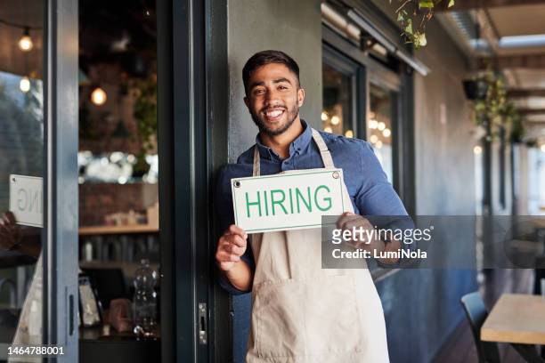 cafe, hiring and sign with a man small business owner standing outside of his coffee shop for recruitment. portrait, vacancy and a job in the hospitality industry with a male entrepreneur outdoor - small placard stock pictures, royalty-free photos & images