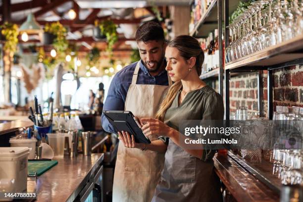 tablet, bartender or small business people for communication, networking or online order check. research, planning startup or teamwork for inventory checklist, stock management or social media review - business cafe bildbanksfoton och bilder