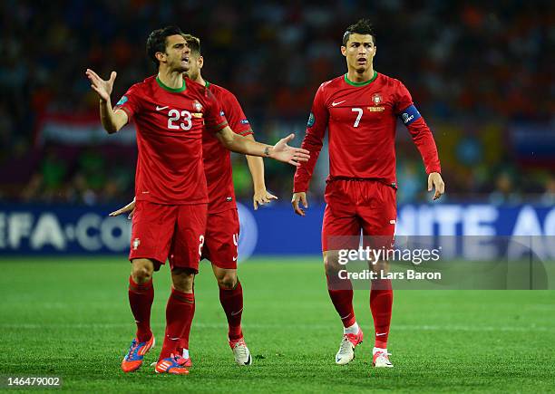Helder Postiga and Cristiano Ronaldo of Portugal react during the UEFA EURO 2012 group B match between Portugal and Netherlands at Metalist Stadium...