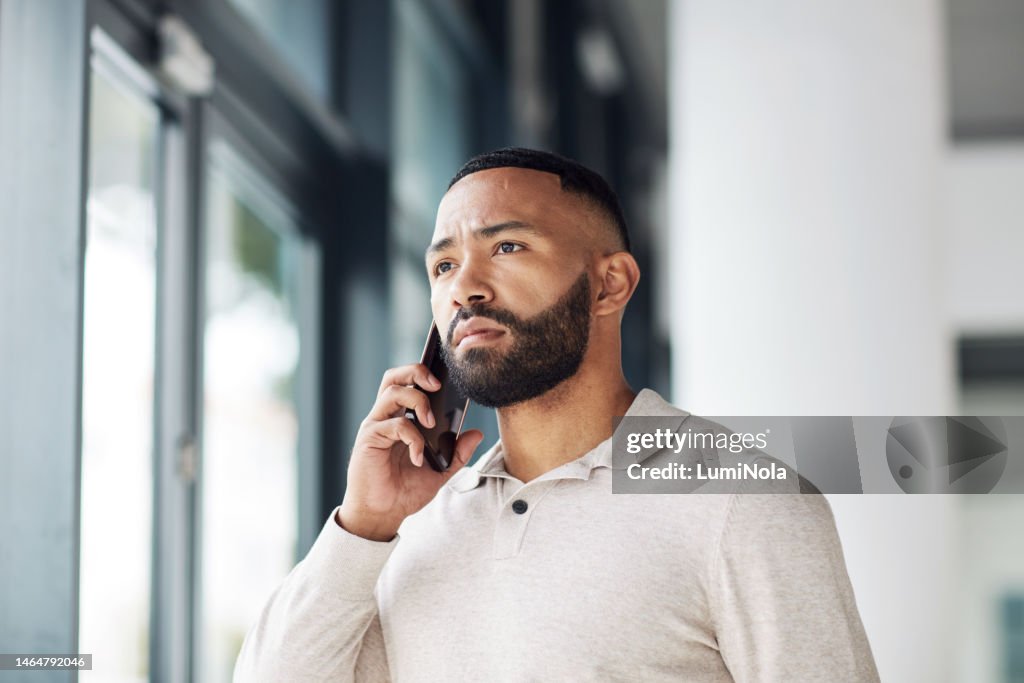 Thinking, serious and businessman talking on a phone call for networking, communication and idea. Listening, focus and employee with a mobile for conversation, discussion and connection at work