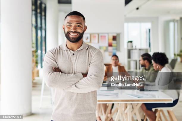 business, black man and portrait with arms crossed of manager, leadership and trust in chicago. smile, happy and male worker in startup agency for success, employee motivation and office management - portrait blurred background stockfoto's en -beelden
