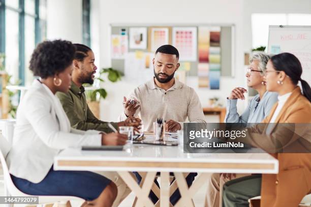 meeting, planning and creative team working on a project together in the boardroom in the office. brainstorming, diversity and advertising people in discussion on creativity report in workplace. - job centre stock pictures, royalty-free photos & images
