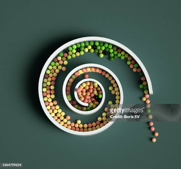 spheres escaping from spiral - circular economy stock pictures, royalty-free photos & images