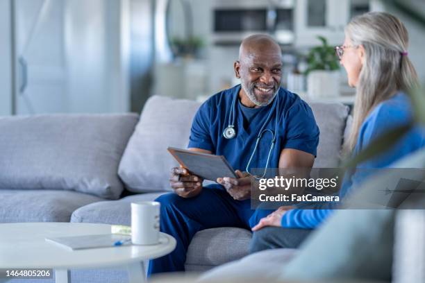 homecare nurse with a patient - house call stock pictures, royalty-free photos & images