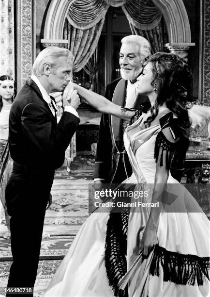American actors Richard Widmark , Cesar Romero and French actress Genevieve Page during the filming of the movie 'A Talent for Loving  Madrid,...