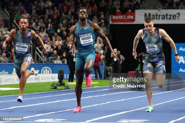 Reece Prescod of Great Britain approaches the finish line to win the Men's 60 Metres final before Joshua Hartmann of Germany and Julian Wagner of...