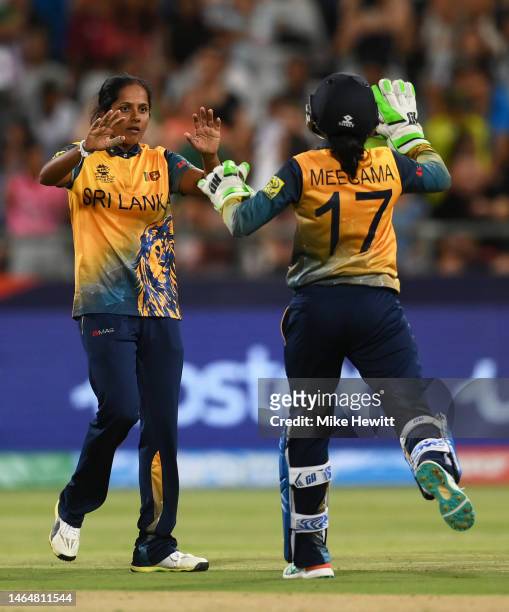 Inoka Ranaweera of Sri Lanka celebrates the wicket of Sune Luus of South Africa with team mate Anushka Sanjeewani during the ICC Women's T20 World...