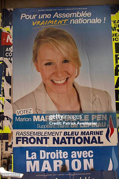 Defaced poster of Marion Marechal Le Pen the granddaughter of Jean Marie Le Pen, the founder of the Front National is seen June 17, 2012 in...