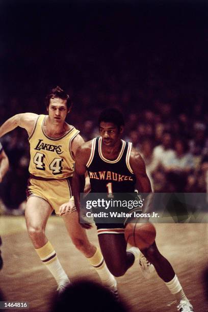 Oscar Robertson#14 of the Milwaukee Bucks drives to the basket against Jerry West of the Los Angeles Lakers in Los Angeles, CA. NOTE TO USER: User...