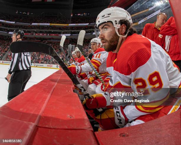 Dillon Dube of the Calgary Flames watches the action from the bench against the Detroit Red Wings during the first period of an NHL game at Little...