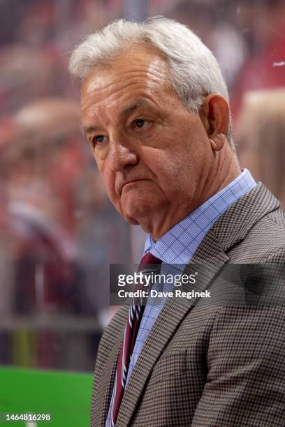 Head coach Darryl Sutter of the Calgary Flames watches the action from the bench against the Detroit Red Wings during the first period of an NHL game...