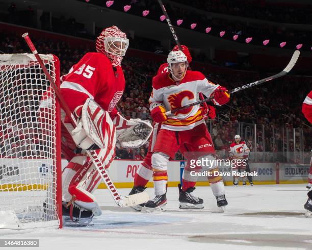 Jakob Pelletier of the Calgary Flames sets up in front of Ville Husso of the Detroit Red Wings during the third period of an NHL game at Little...
