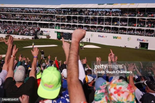 Fans cheer after Jon Rahm of Spain made his putt on the 16th green during the second round of the WM Phoenix Open at TPC Scottsdale on February 10,...