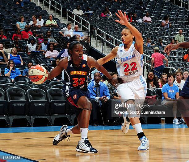 Kalana Greene of the Connecticut Sun drives against Armintie Price of the Atlanta Dream at Philips Arena on June 17, 2012 in Atlanta, Georgia. NOTE...