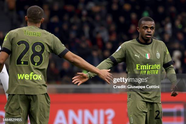 Pierre Kalulu of AC Milan and Malick Thiaw gestures during the Serie A match between AC MIlan and Torino FC at Stadio Giuseppe Meazza on February 10,...