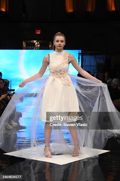 Model walks the runway wearing Camellia Couture during NYFW hiTechMODA Season 9 at Gotham Hall on February 10, 2023 in New York City.