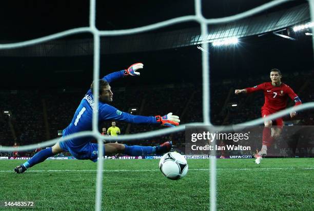 Cristiano Ronaldo of Portugal scores his team's second goal past Maarten Stekelenburg of Netherlands during the UEFA EURO 2012 group B match between...