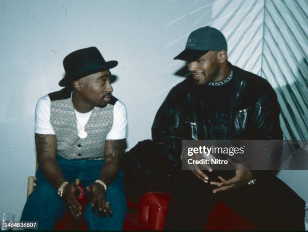 American Rap musician Tupac Shakur and Heavyweight boxer Mike Tyson talk with one another, Las Vegas, Nevada, circa 1996.