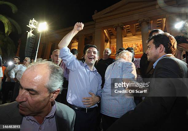 Alexis Tzipras , the leader of the Syriza party, cheers following a rally outside the university building following an expected second place in the...