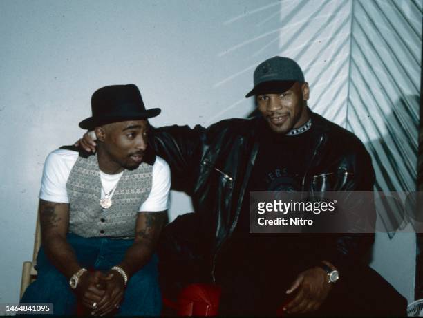 American Rap musician Tupac Shakur and Heavyweight boxer Mike Tyson talk with one another, Las Vegas, Nevada, circa 1996.