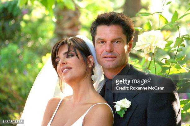 Actors Lisa Rinna and Harry Hamlin pose for a portrait in their garden where they were married on March 29, 1997 in Beverly Hills, California.