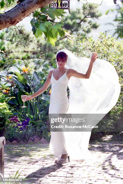 Actors Lisa Rinna dances in the garden where she was married on March 29, 1997 in Beverly Hills, California.