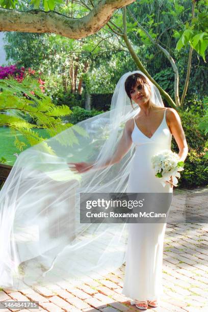 Actress Lisa Rinna stands in the breeze in the garden where she was married on March 29, 1997 in Beverly Hills, California.