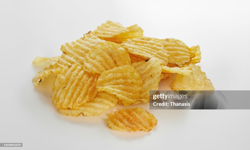 Close-up of crispy fried waffle potato chips