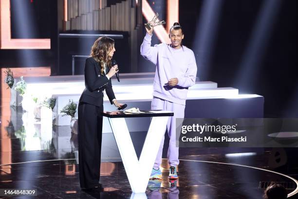 Host Laury Thilleman presents Stromae with the Best Male Artist award during the 38th "Les Victoires De La Musique" Award Ceremony At La Seine...