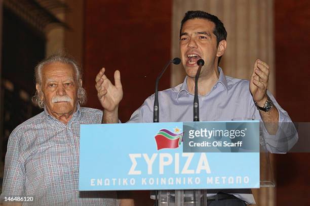 Alexis Tsipras , the leader of the Syriza party, stands next to Greek resistance hero Manolis Glezos as he addresses the crowd at a rally outside the...