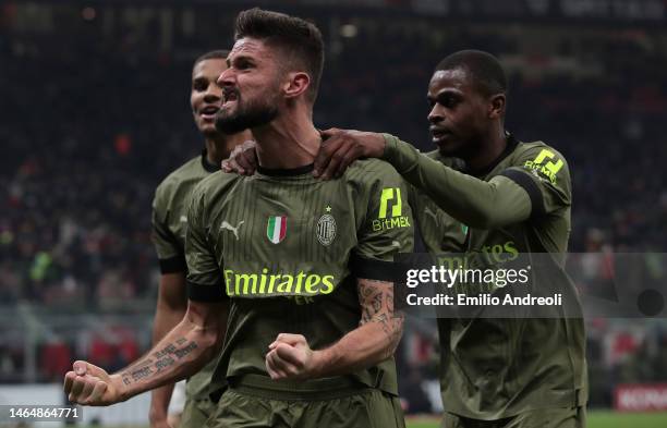 Olivier Giroud of AC Milan celebrates with his team-mates Malick Thiaw and Pierre Kalulu after scoring the opening goal during the Serie A match...