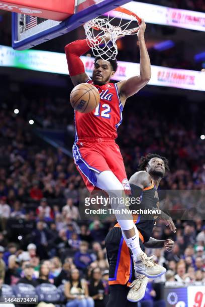 Tobias Harris of the Philadelphia 76ers dunks past Julius Randle of the New York Knicks during the first quarter at Wells Fargo Center on February...