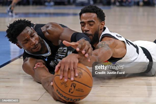 Jaren Jackson Jr. #13 of the Memphis Grizzlies and Mike Conley of the Minnesota Timberwolves fight for the ball during the first half at FedExForum...