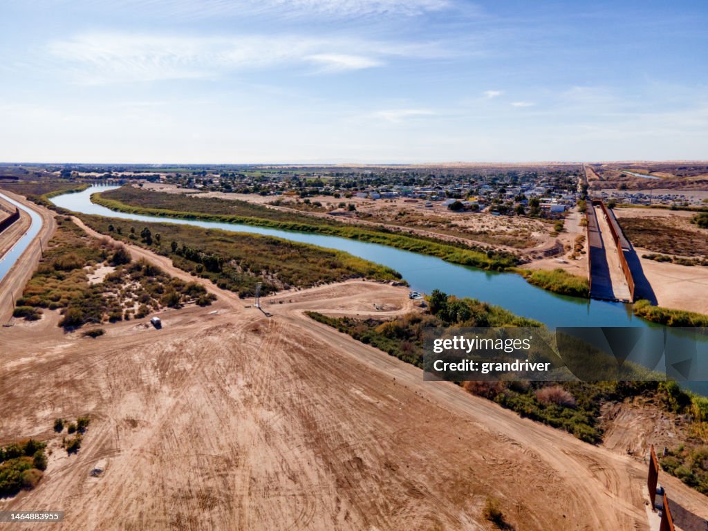 International Border Wall with Agricultural Fields, Canal and Colorado River Between Yuma, Arizona and Algodones Mexico with Water Diversion and Aquaduct Operation Conserving Scarce Water Resources