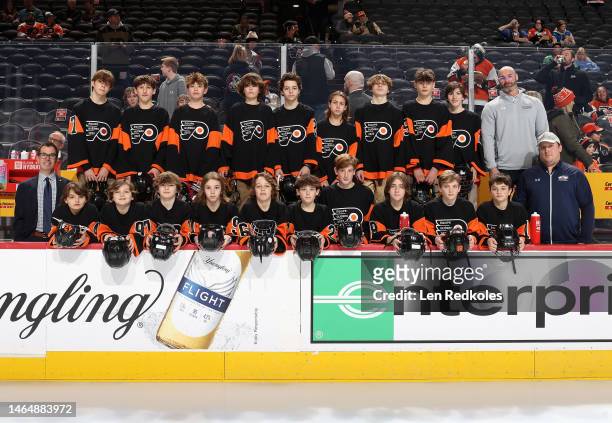 Members of the Quebec AAA Philadelphia Flyers Pee Wee Tournament Team posies for a team photo prior to warm-ups between the Philadelphia Flyers and...