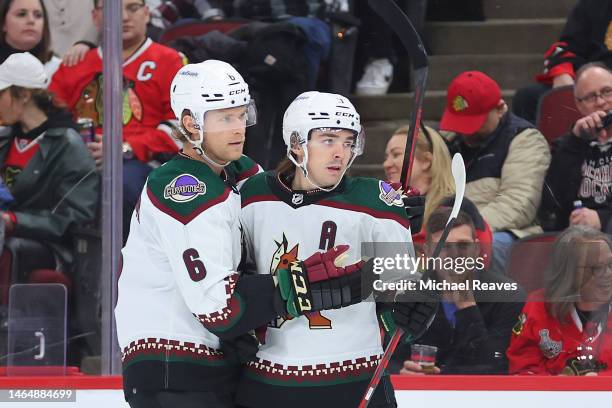 Clayton Keller of the Arizona Coyotes celebrates with Jakob Chychrun after scoring a goal against the Chicago Blackhawks during the first period at...