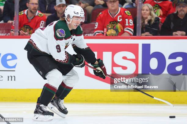 Clayton Keller of the Arizona Coyotes skates with the puck against the Chicago Blackhawks during the first period at United Center on February 10,...