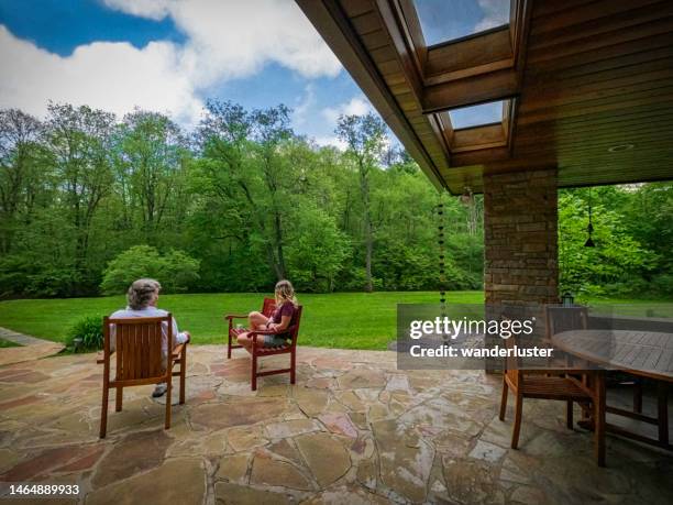 father and daughter hanging out in the back yard - family back yard stockfoto's en -beelden