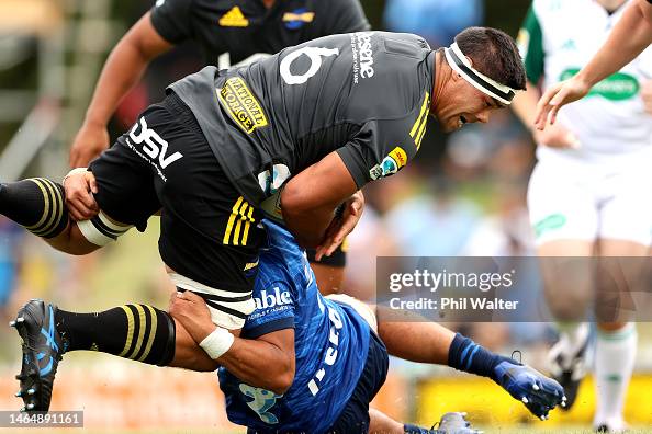 Dvc Rugby TK Howden of the Hurricanes is tackled during the Super Rugby trial ...