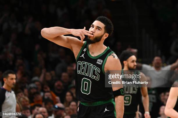 Jayson Tatum of the Boston Celtics reacts after scoring against the Charlotte Hornets during the fourth quarter of the game at the TD Garden on...