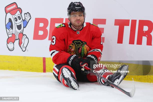 Max Domi of the Chicago Blackhawks reacts after a collision with Connor Ingram of the Arizona Coyotes during the second period at United Center on...