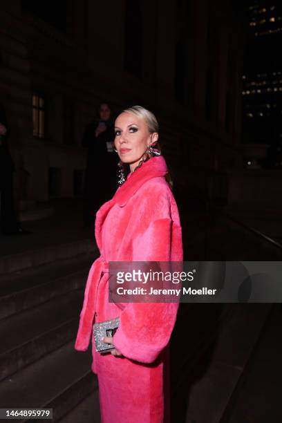 Denisa Palsha wearing Paco Rabanne silver matching suit, AREA long silver earrings, dolce&gabbana silver sparkling bag, Nour Hammour long pink fluffy...