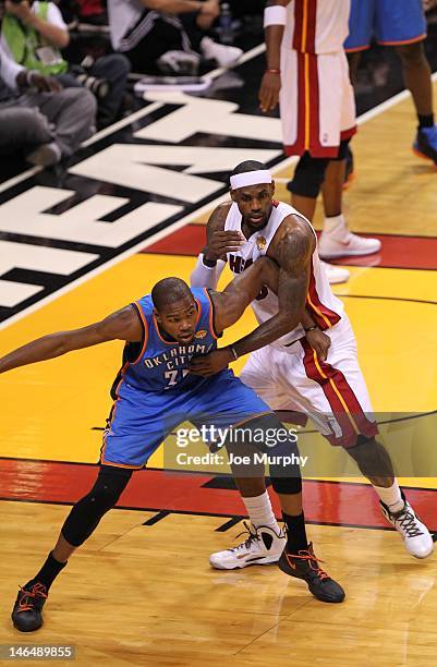 LeBron James of the Miami Heat guards Kevin Durant of the Oklahoma City Thunder during Game Three of the 2012 NBA Finals between the Miami Heat and...