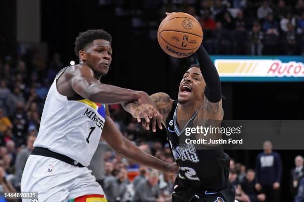 Ja Morant of the Memphis Grizzlies handles the ball against Anthony Edwards of the Minnesota Timberwolves during the second half at FedExForum on...