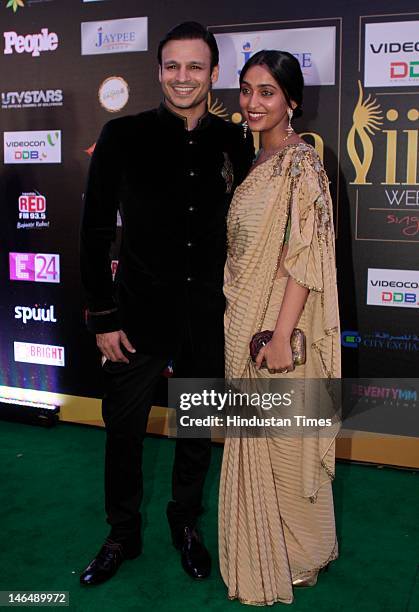 Bollywood actor Vivek Oberoi with his wife Priyanka Oberoi posing for the camera on Green carpet of International India Film Academy Awards...
